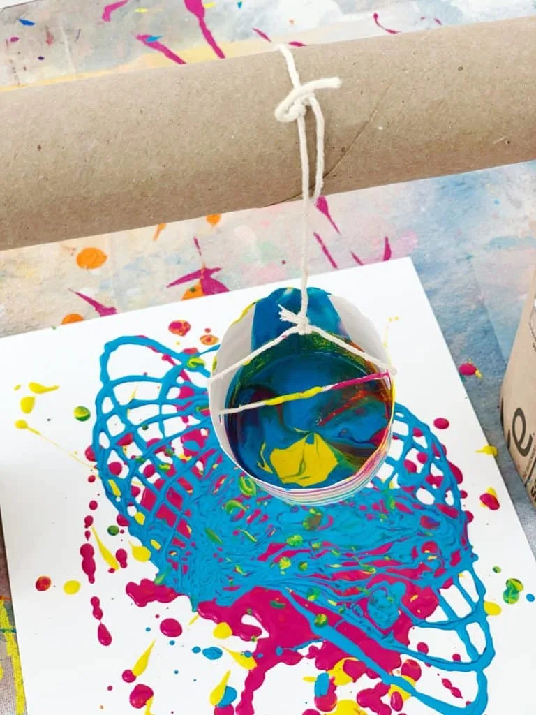 Pendulum Painting With Kids using recycled materials