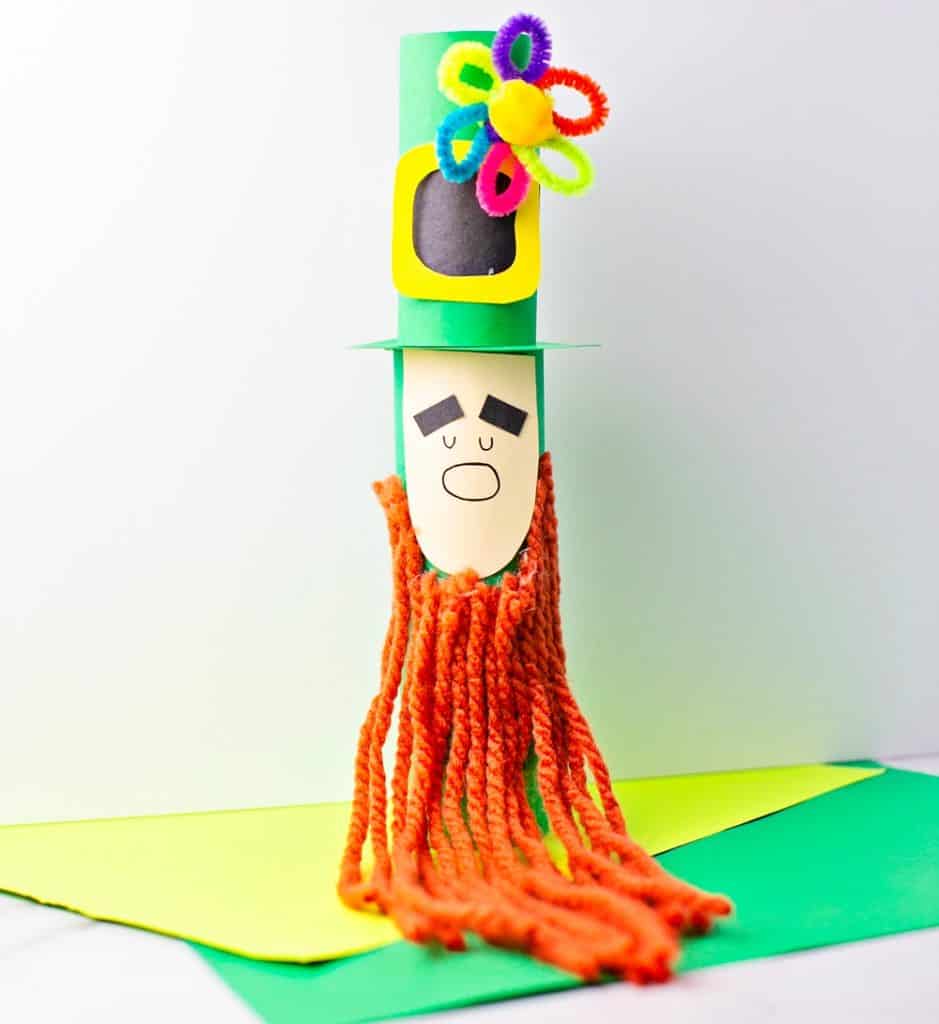 Paper tube Leprechaun craft for kids St Patrick's Day activity. Trim the leprechaun beard. 