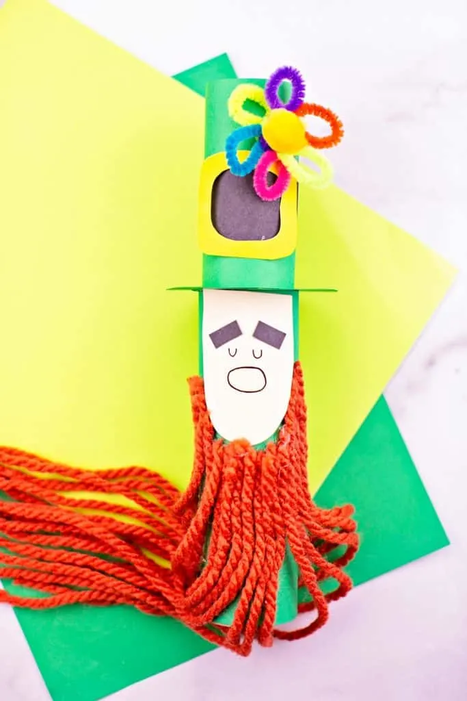 Paper tube Leprechaun craft for kids St Patrick's Day activity. Trim the leprechaun beard. 