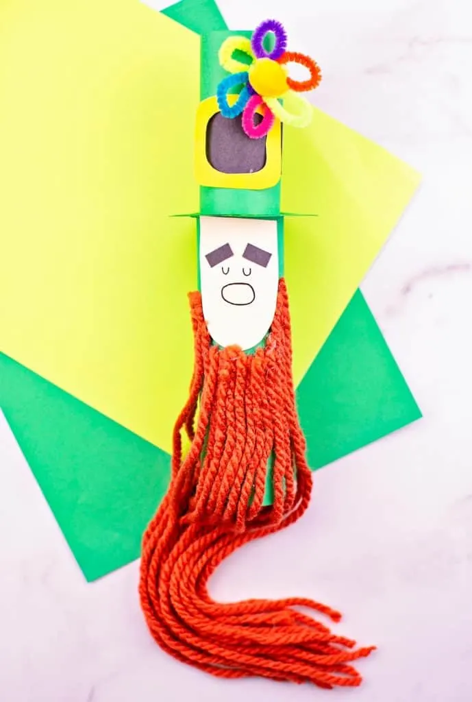 Paper tube Leprechaun craft for kids St Patrick's Day activity. Trim the leprechaun beard. 
