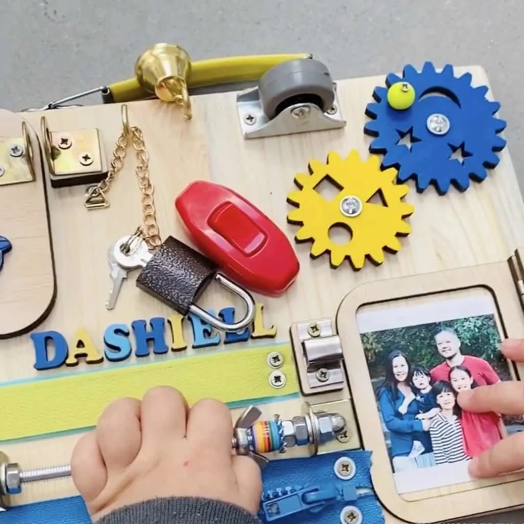 Toddler Busy Board. Great fine motor toddler or preschooler toy. 