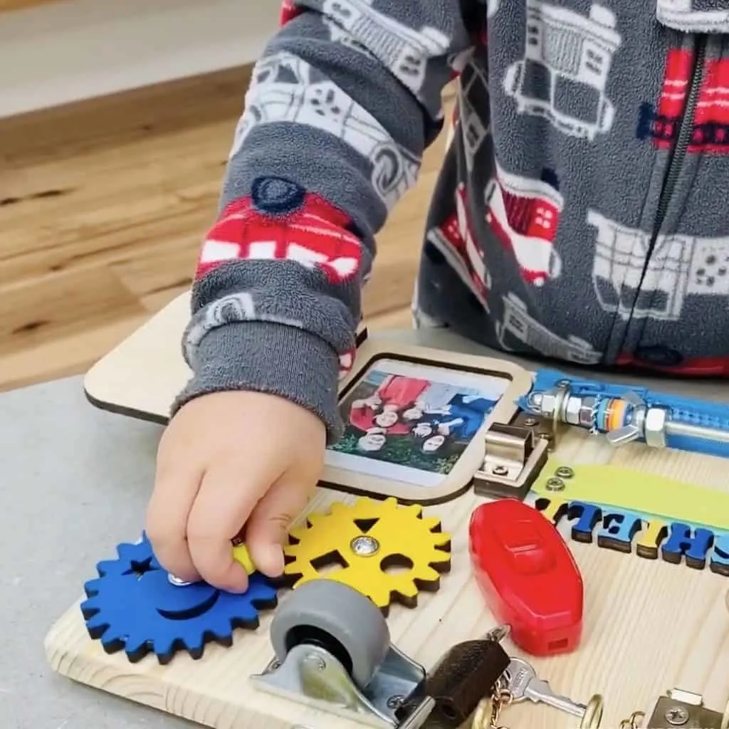 Toddler Busy Board. Great fine motor toddler or preschooler toy. 