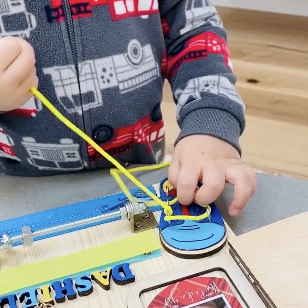 Toddler Busy Board. Great fine motor toddler or preschooler toy. 