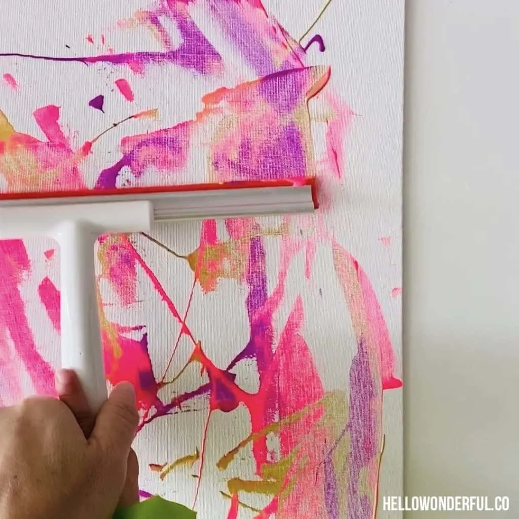 squeegee painting with toddlers. Fun low-mess painting with beautiful results