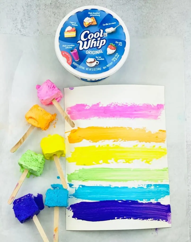 two ingredient taste safe paint made with Cool Whip. Paint on popsicle sticks and paper. 