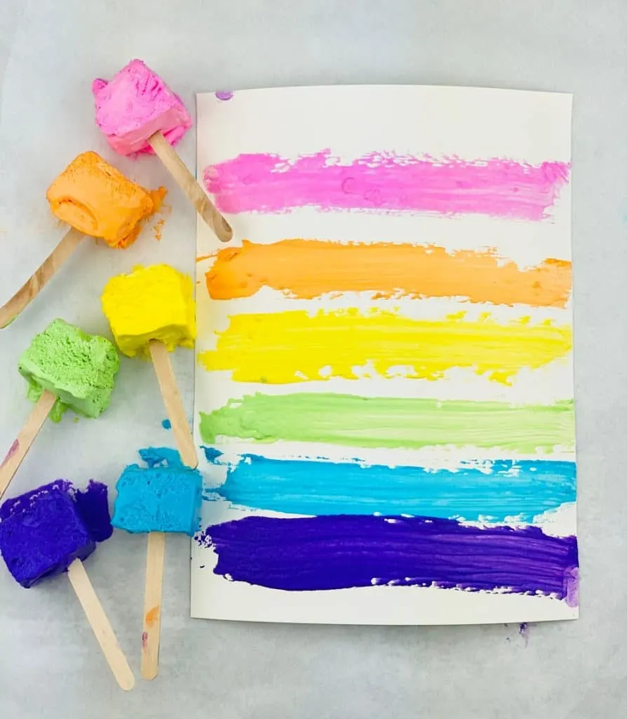 two ingredient taste safe paint made with Cool Whip. Paint on popsicle sticks and paper. 