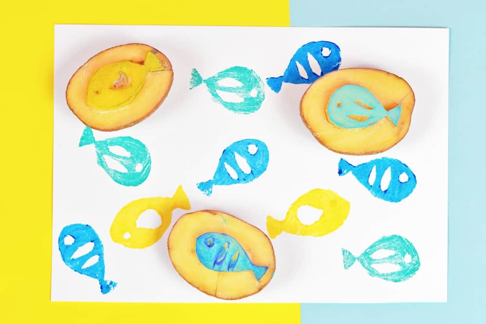 potato fish stamp. Carved fish shapes from potatoes and use acrylic paint to stamp onto paper. 