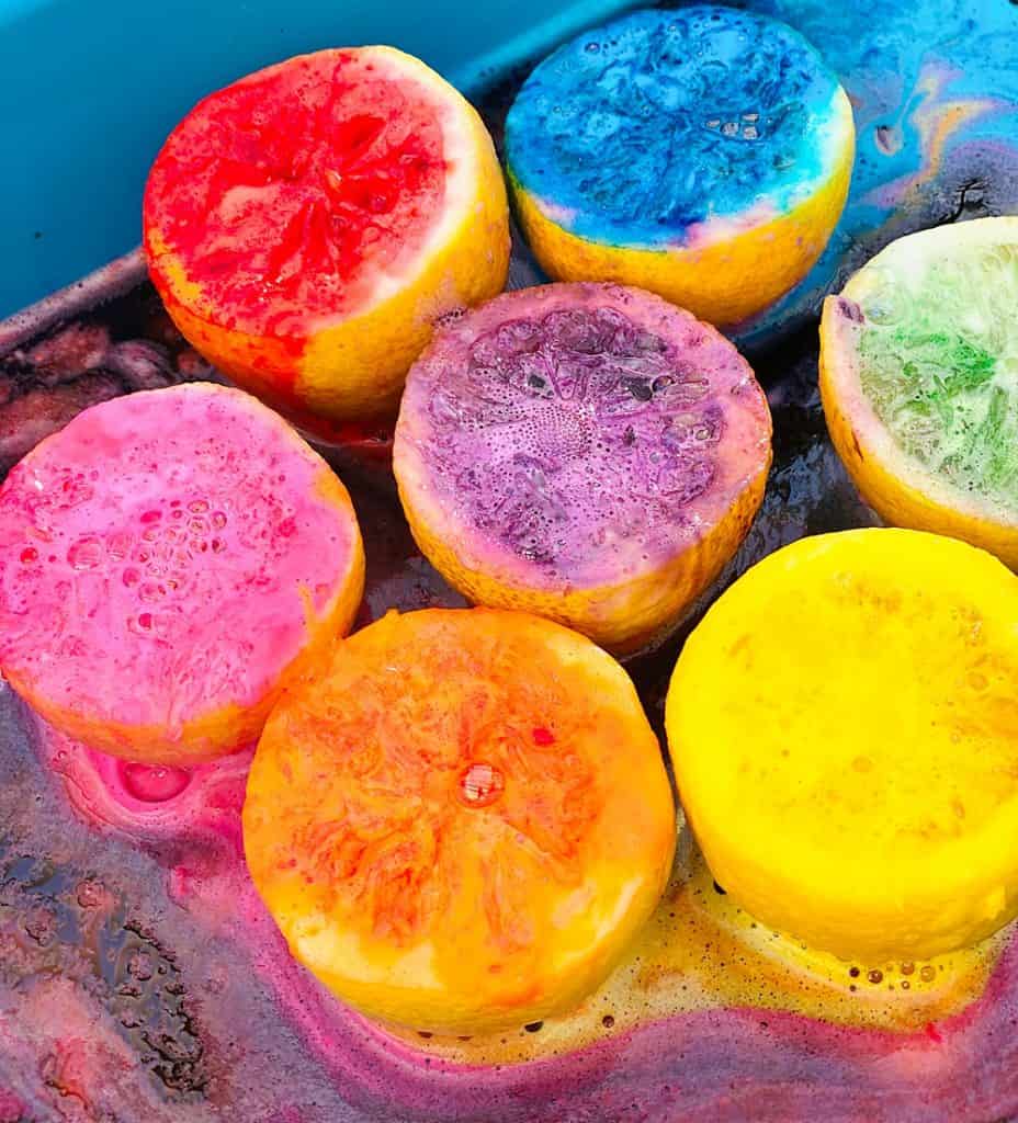 fizzy rainbow colored lemon halves from making volcanoes