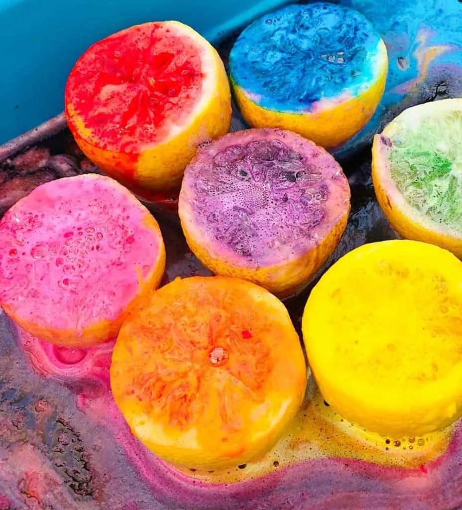 fizzy rainbow colored lemon halves from making volcanoes