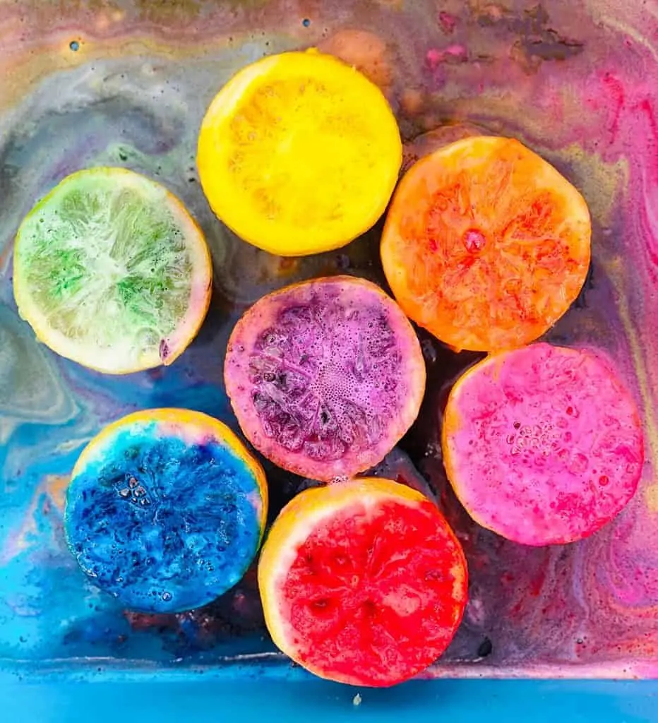 fizzy rainbow colored lemon halves from making volcanoes