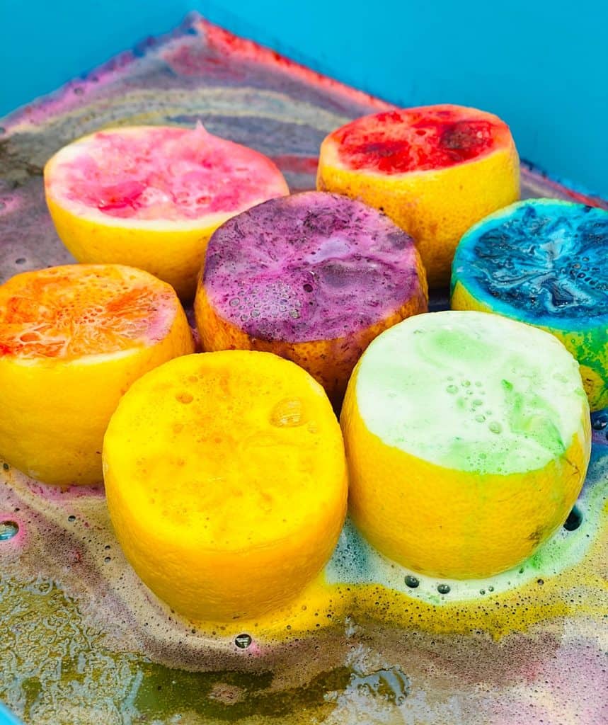 fizzy rainbow colored lemon halves from making volcanoes science for kids