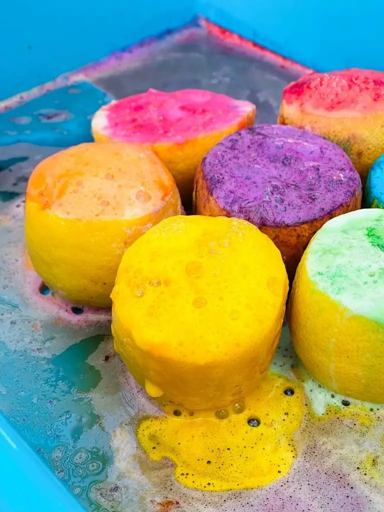 fizzy rainbow colored lemon halves from making volcanoes science for kids