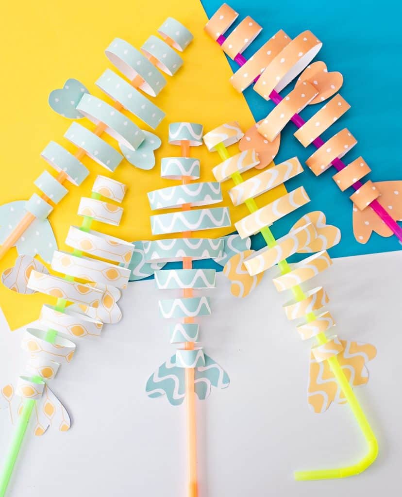 paper fish craft made from colorful strips of paper and straws 