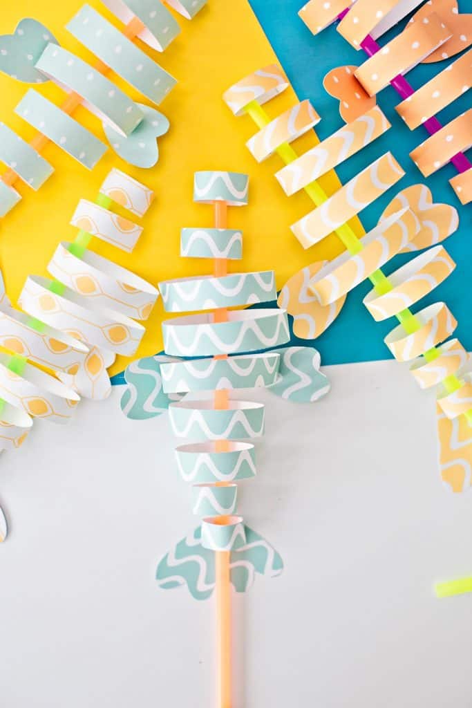 paper fish craft made from colorful strips of paper and straws 