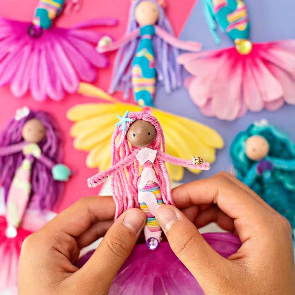 diy mermaid dolls made with pipe cleaners, flowers, yarns and ribbon