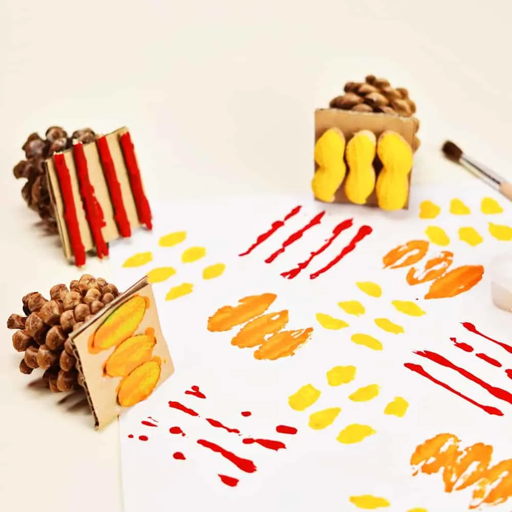 fall art stamps using pine cones and fall foliage