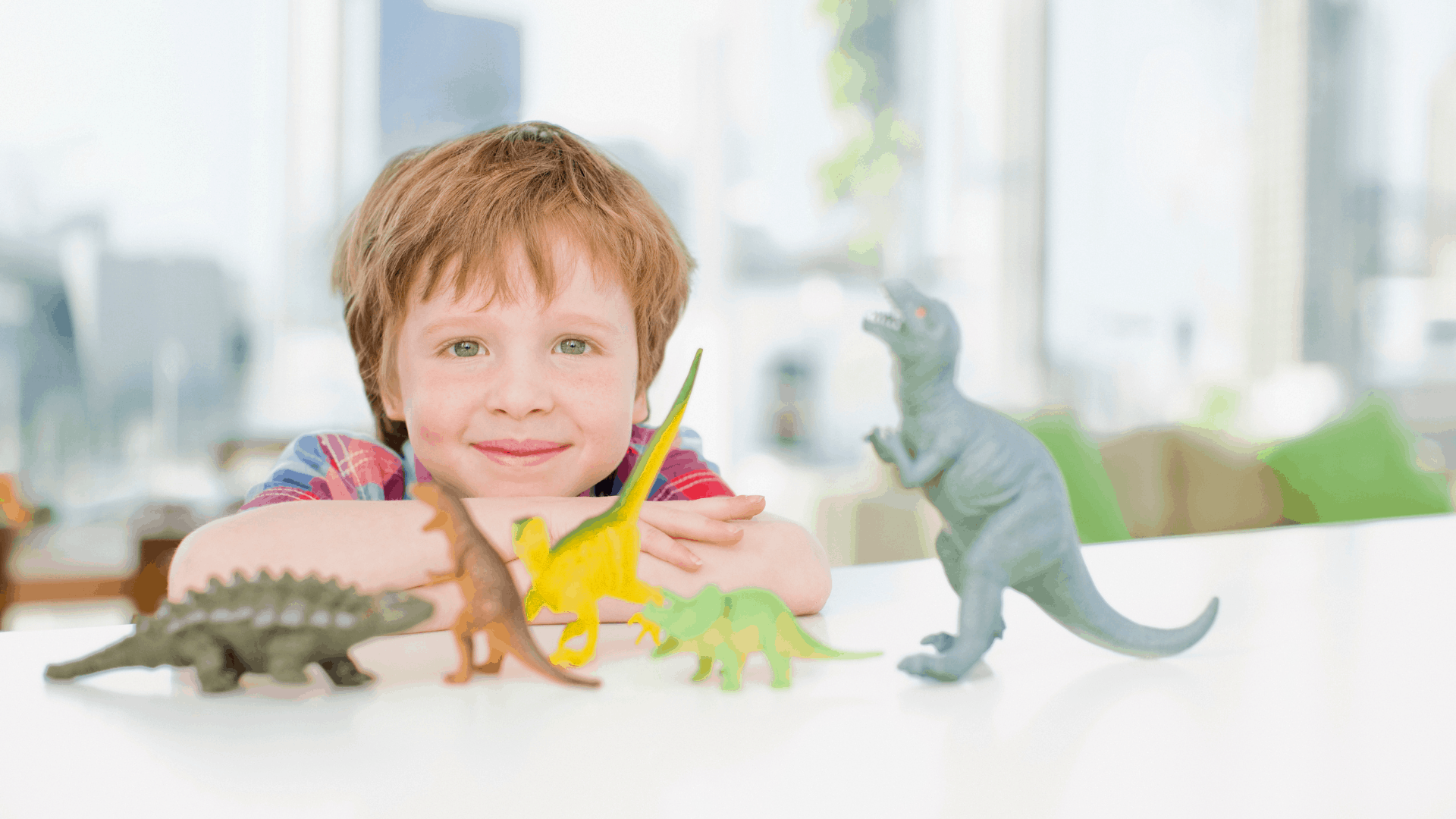 kid playing with dinosaurs