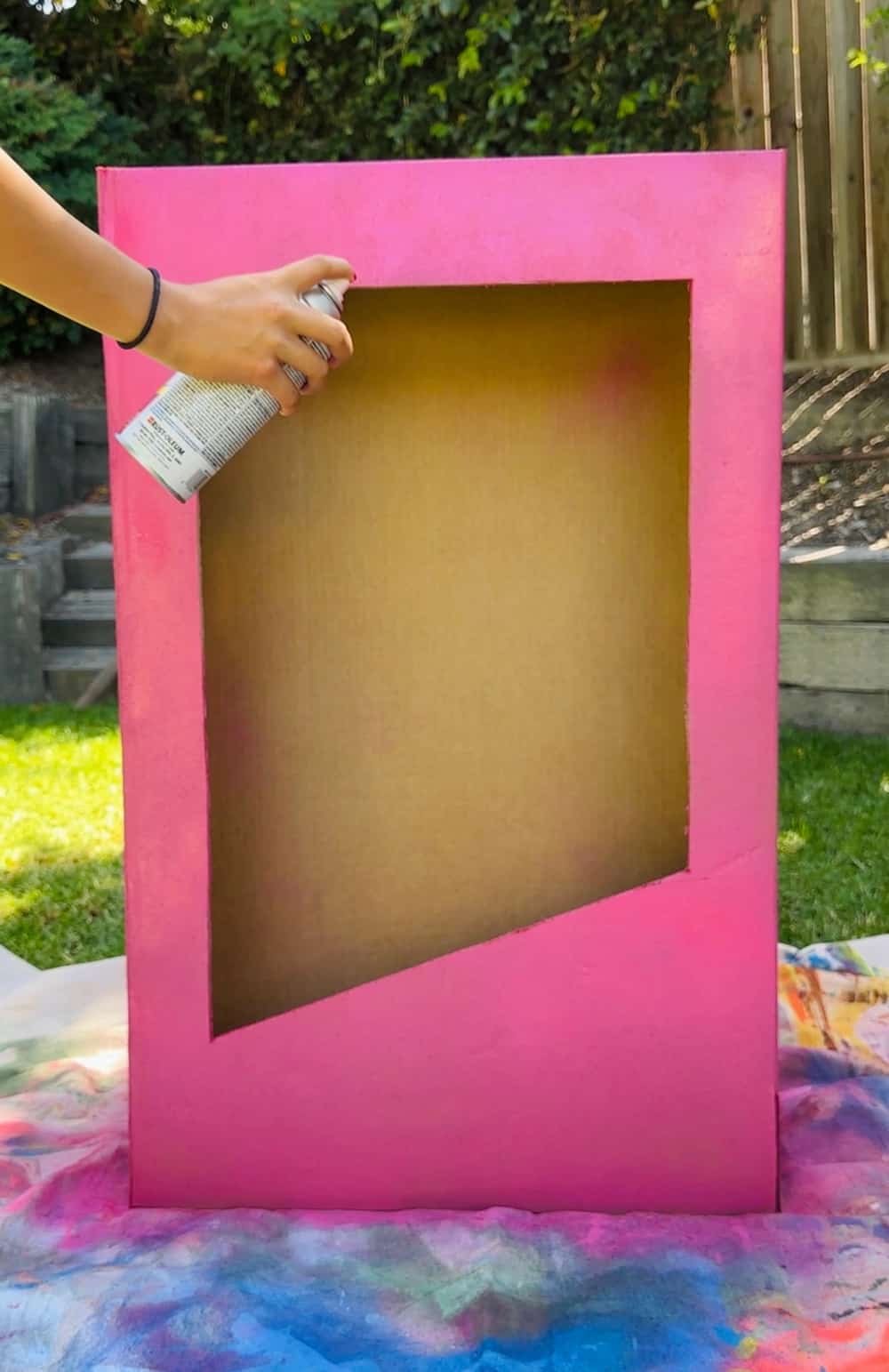spray painting box pink for barbie costume